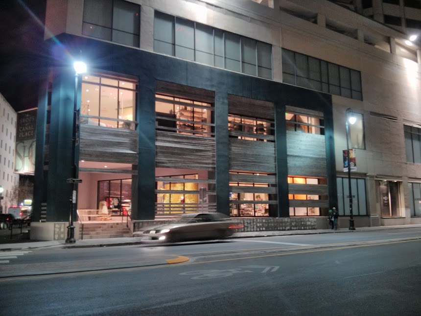 This thing that looks like a boarded-up, impoverished building actually seems to be an uppity clothing stor.