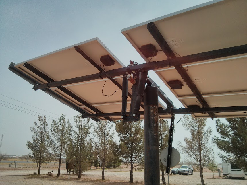 This sort of solar panel is really neat- no motors. It has two tubes of freon, and the panel tracks the sun by letting them expand as the sun moves across the horizon and push the surface in whatever direction the sun is facing. Very cool!