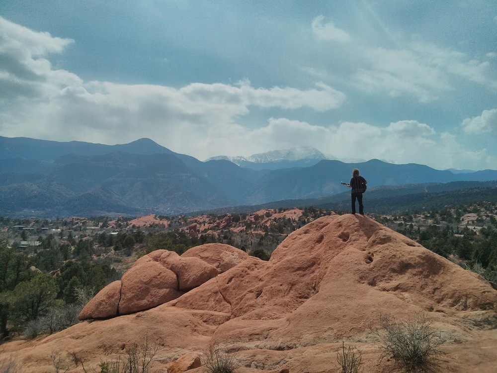 This guy was standing on the edge of a ledge, singing Christian songs out into the wind, in his dirty bare feet. His barefoot friend was in a crevice below this man't perch, philosophizing with him when he wasn't playing.