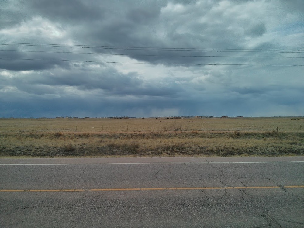 See all that blueish-grey below the clouds? That's rain miles away.
