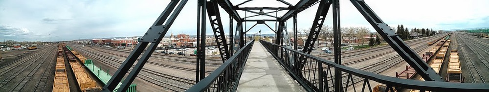 Where was a pedestrian bridge over a railway loading yard. A total of twenty tracks pass under the bridge, along with a contraption designed for taking shipping containers on and off of railway cars.