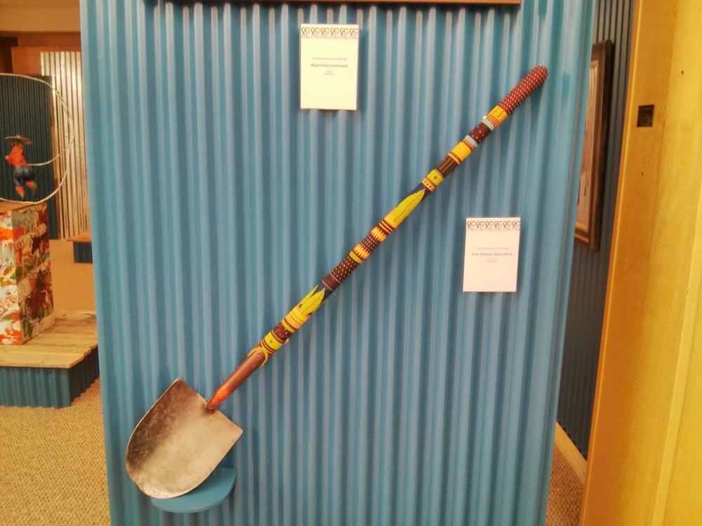 The handle of this shovel is actually covered in tiny beads. Impressive craftsmanship!